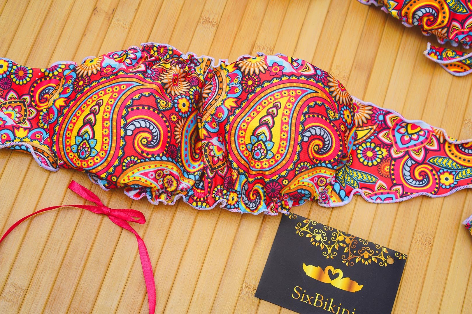 Top Fascia Asia vista alternativa — bandeau paisley con spalline di sostegno